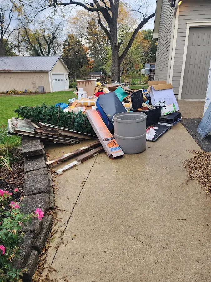 Dumpster being loaded with debris for Commercial Dumpster Rental in Vineyard